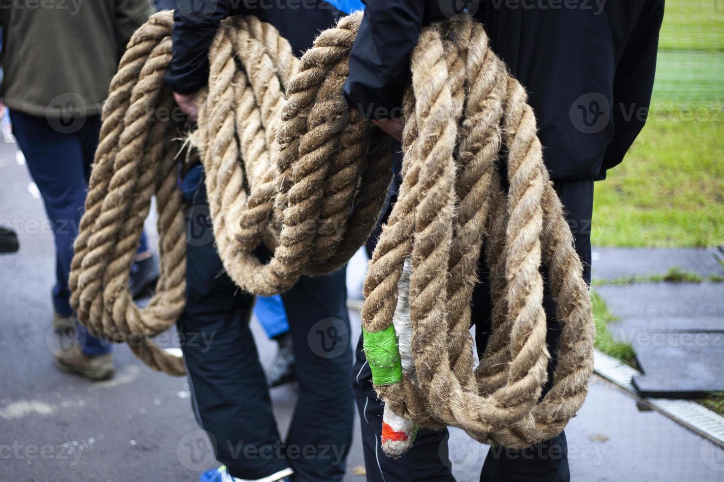 Men are pulling the rope. Sports competition. photo