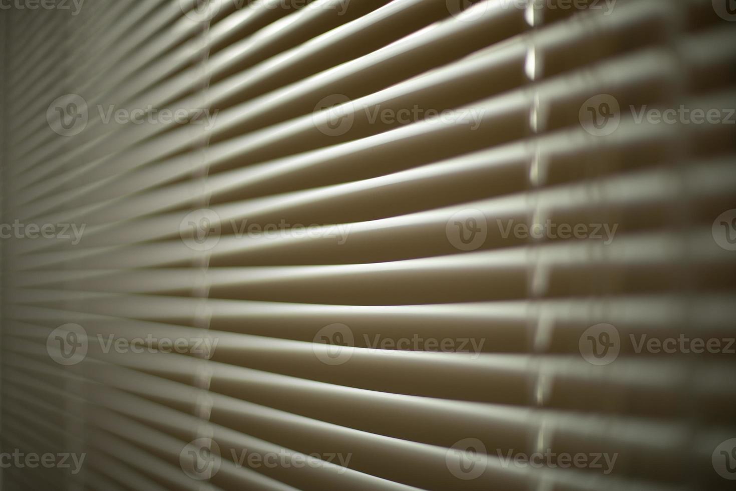 Blinds in office. Interior details. Window is closed from light. Protection from spicy sunlight. photo