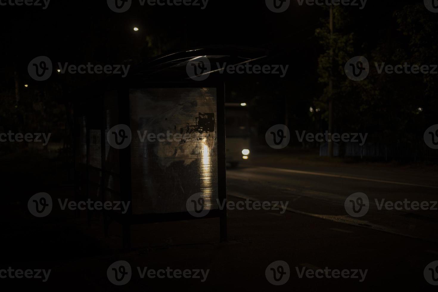 Light at night on road. Bus at night. Dark frame. photo