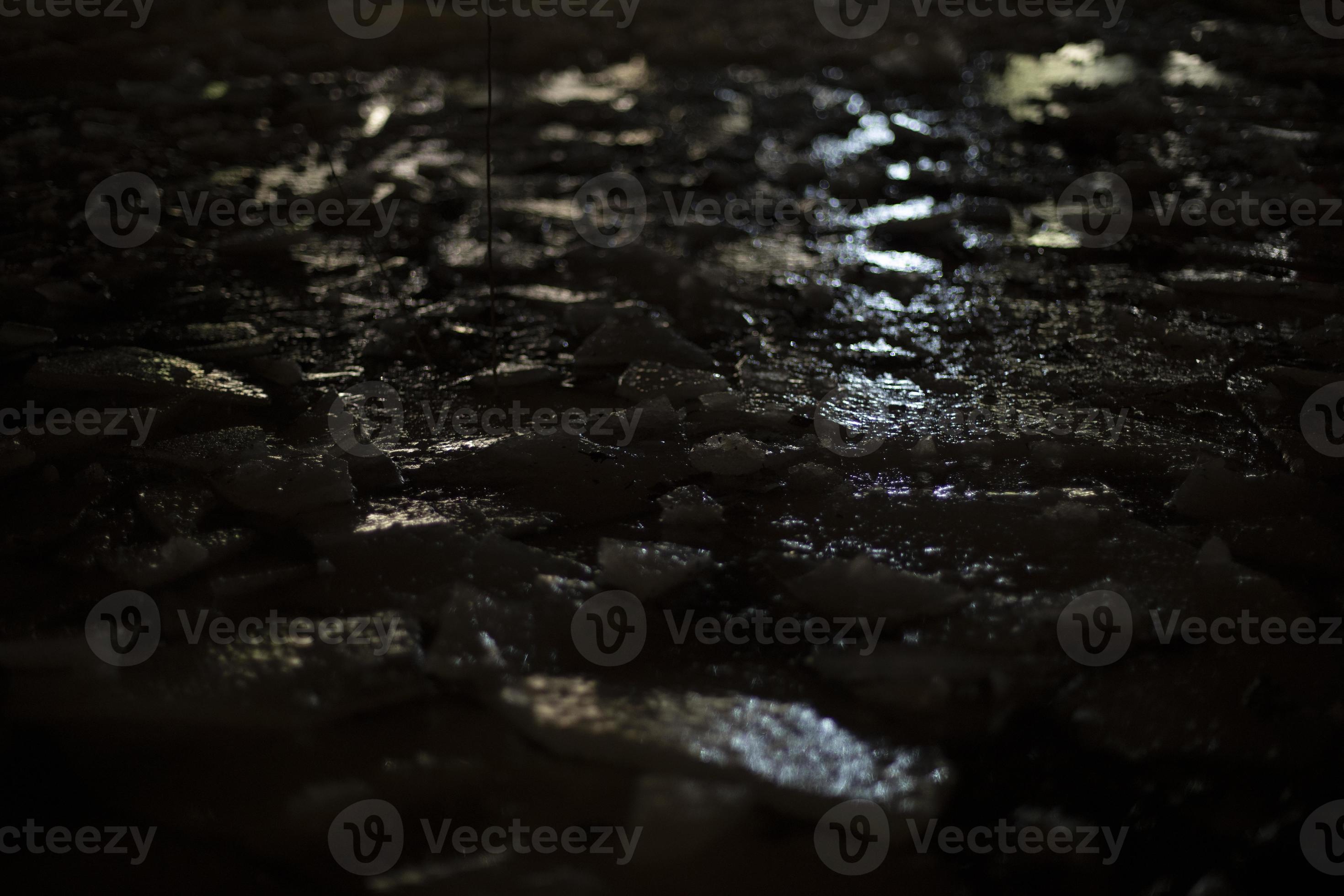 Light on ice in dark. Reflection of artificial light on frozen water. 17411642 Stock Photo at