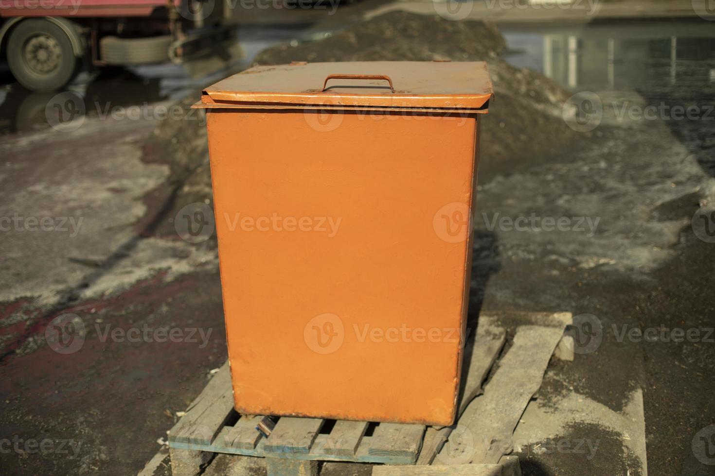 Orange waste tank. Dumpster. photo