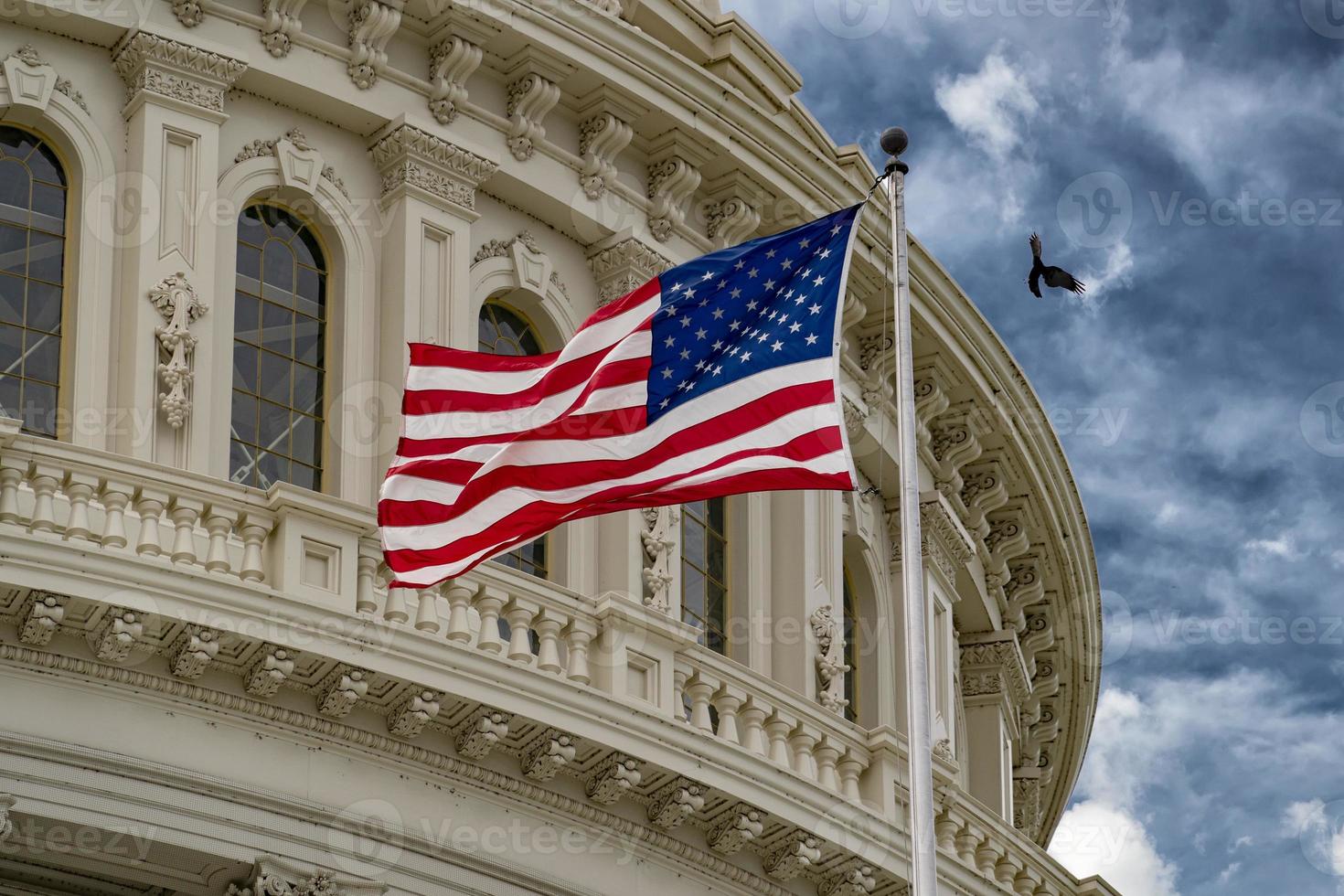 Washington DC capitol with waving flag photo