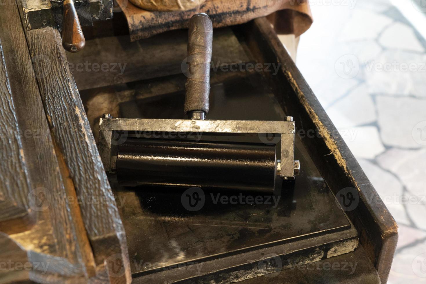 Old ancient print machine hand press photo