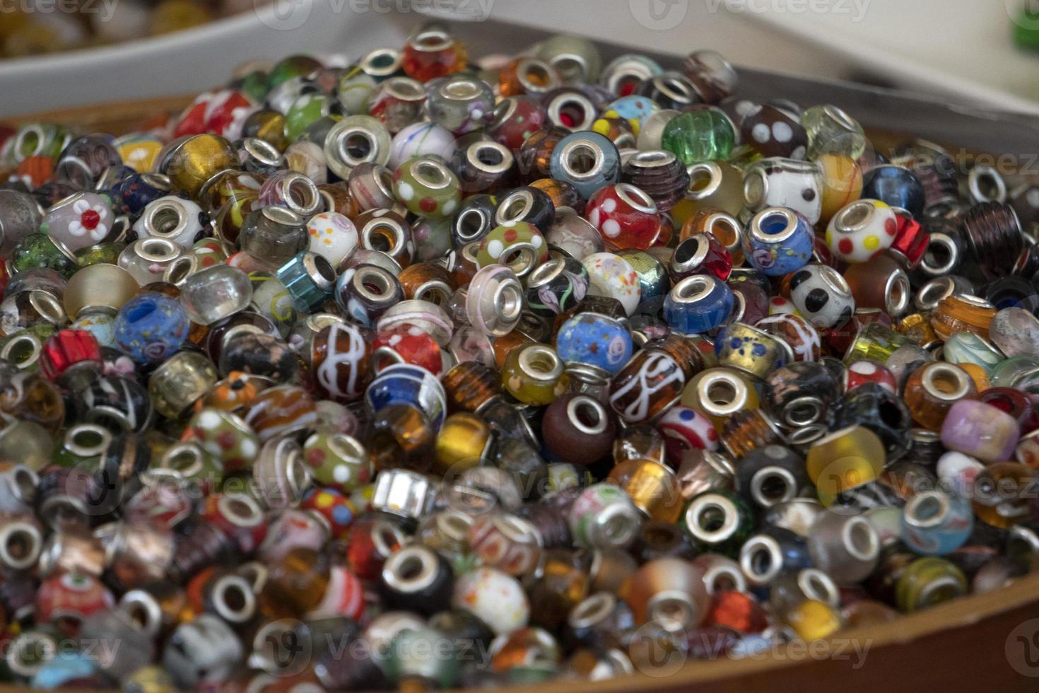 many charms for bracelet for sale at the market photo