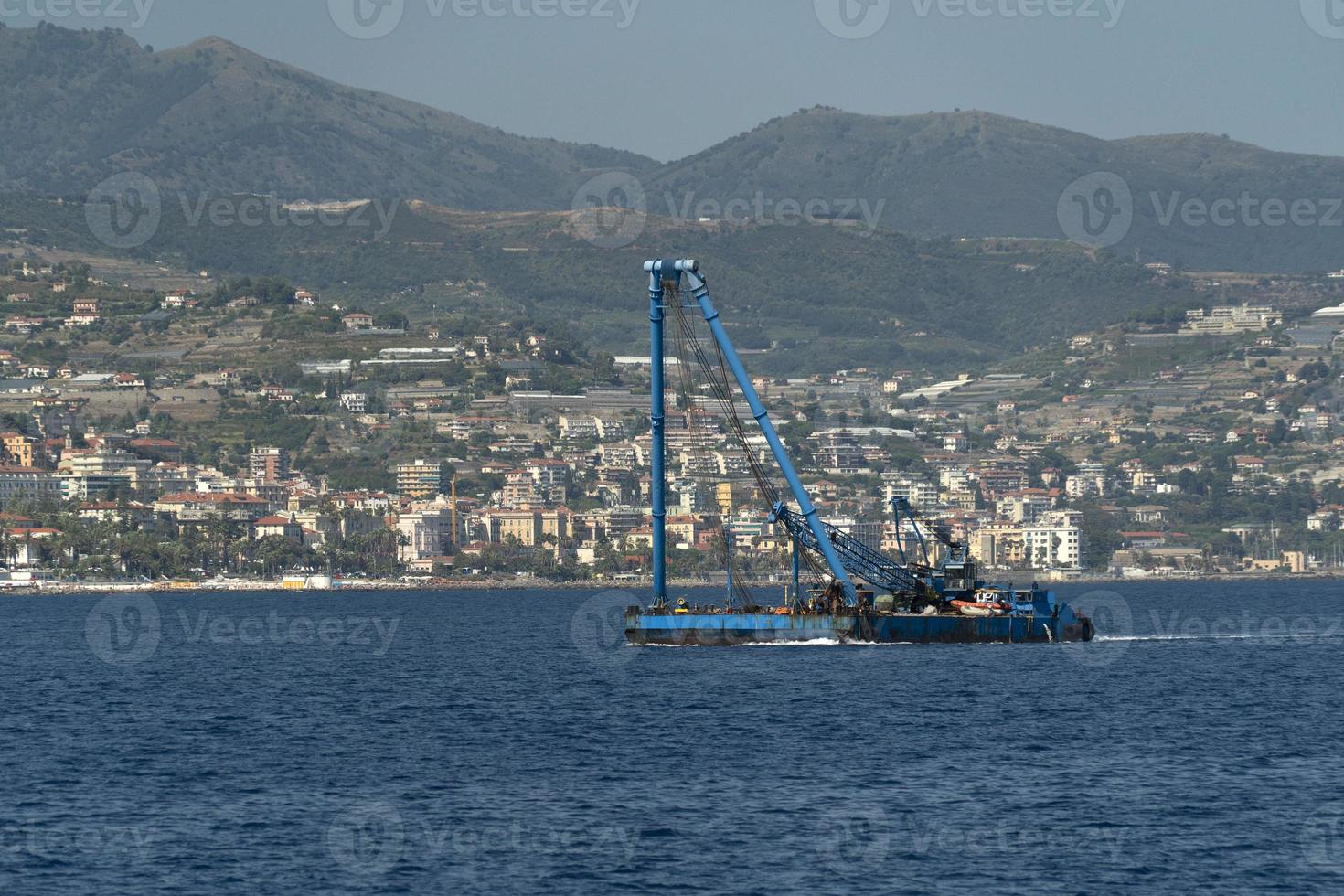 Harbor port dredge working on sea photo