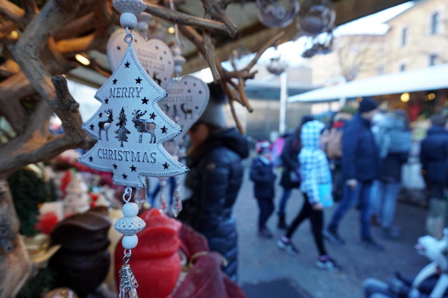 TRENTO, ITALY - DECEMBER 9, 2017 - People at traditional christmas market photo