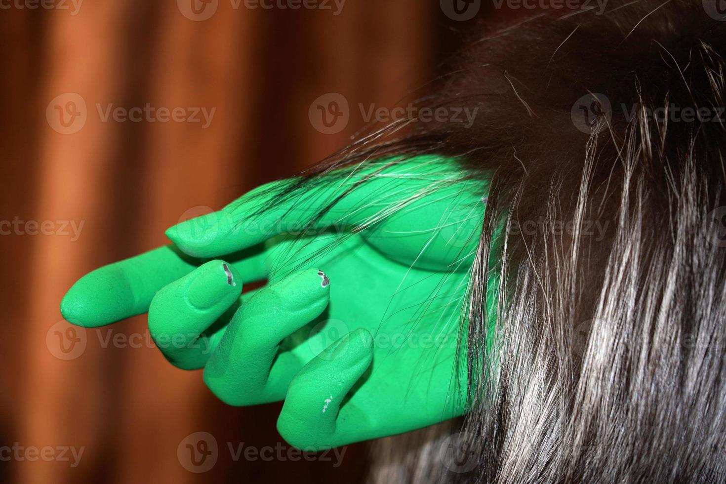 green hand on animal fur clothes detail photo