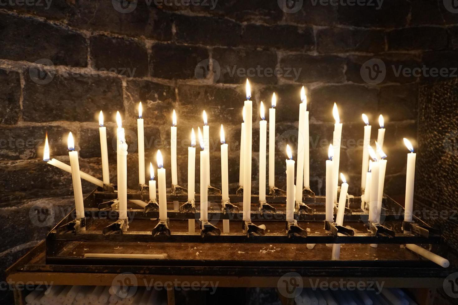 church votive candles white flames photo