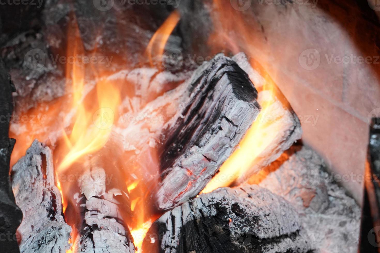 Flames on wood in fireplace photo