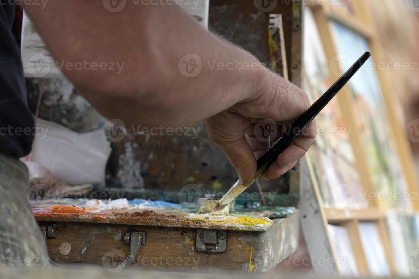 artist painter palette while painting in prague photo