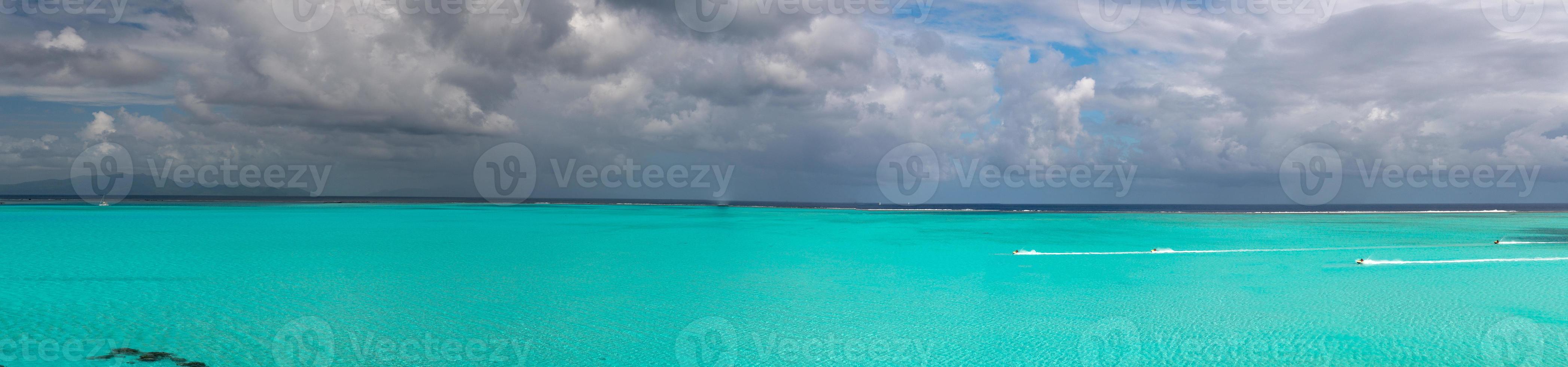 jet ski in french polynesia coconut beach crystal water photo