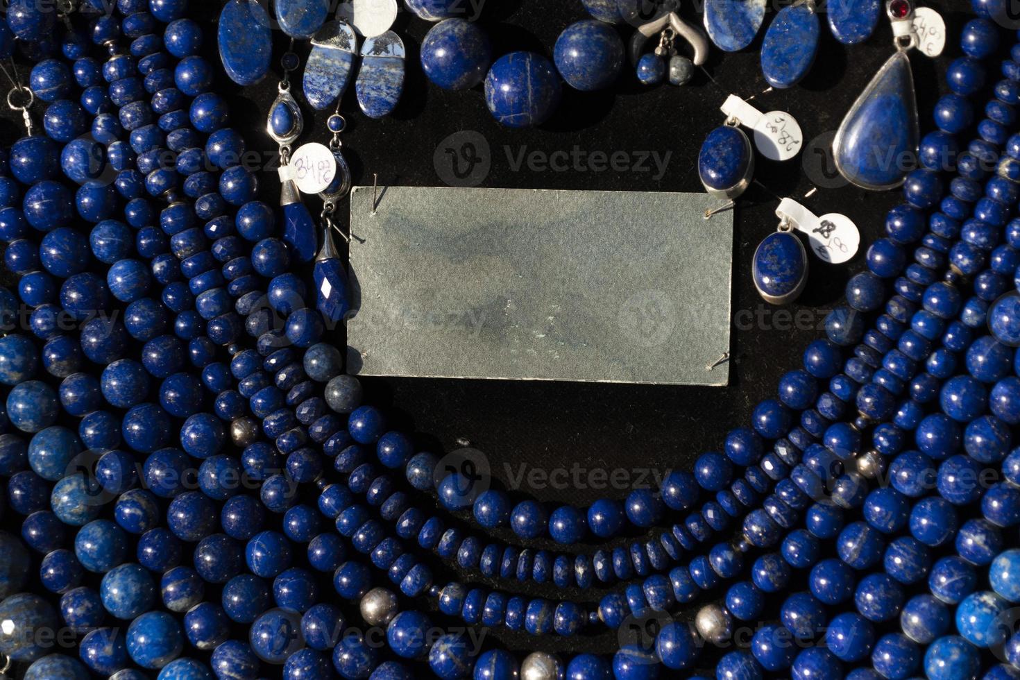 Lapislazuli necklage earrings jewelry on display stand in a shop market photo