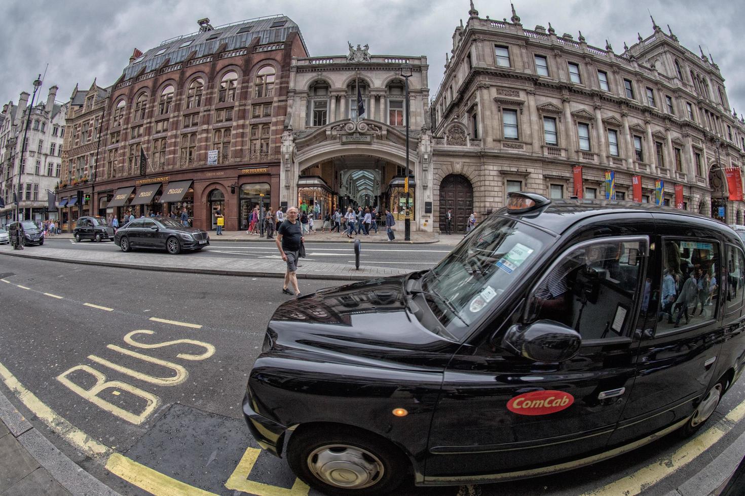 LONDON, ENGLAND - JULY 16 2017 - Tourists and locals in Piccadilly Circus congested town traffic photo