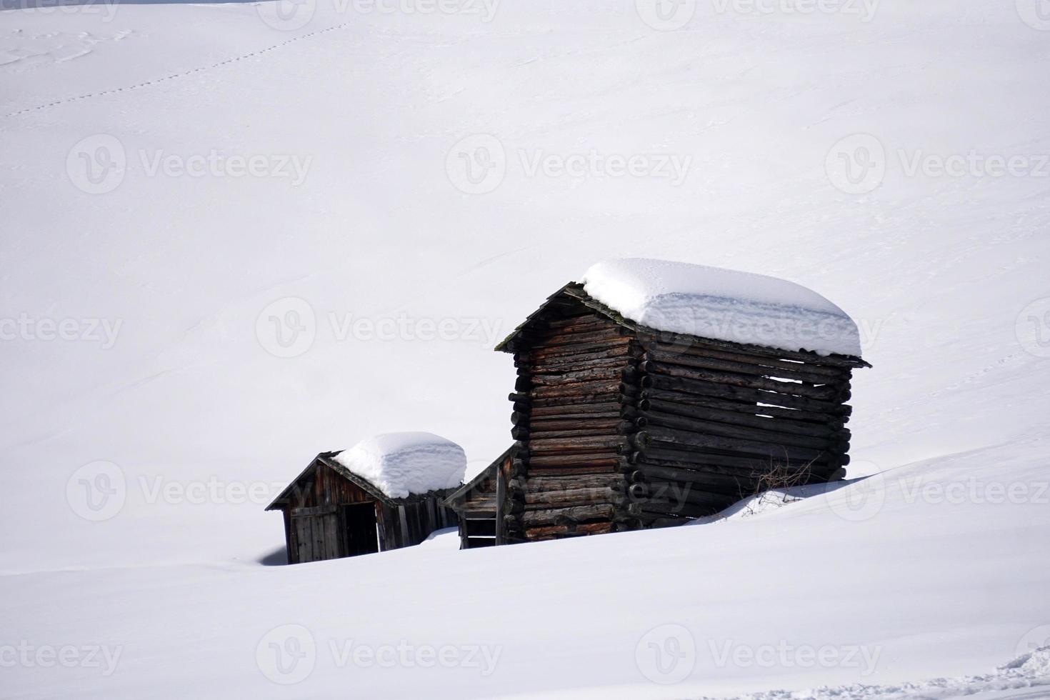 wood cabin hut in the winter snow background photo