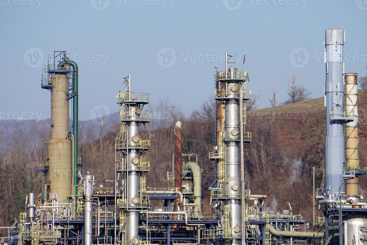 oil refinery smoking chimney detail photo