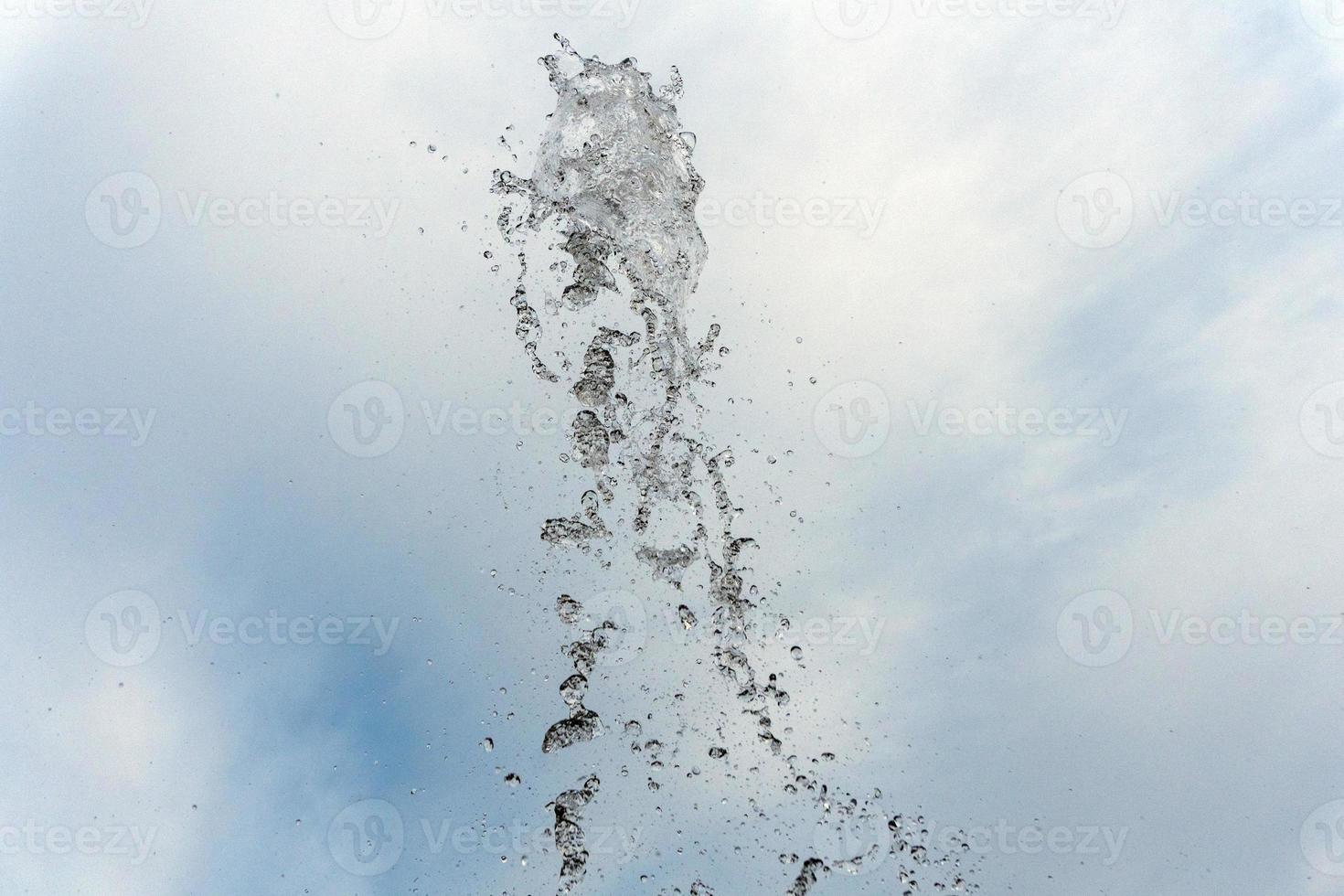 water spurt detail isolated on sky photo