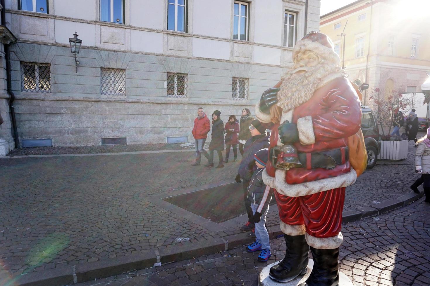 TRENTO, ITALY - DECEMBER 9, 2017 - People at traditional christmas market photo