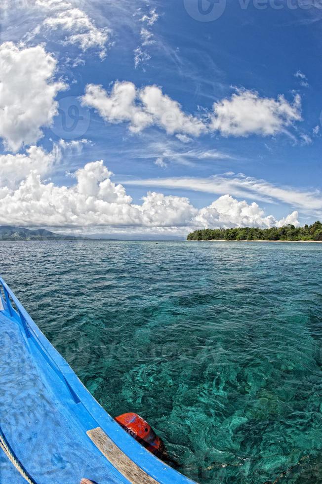 A boat on the reef in tropical paradise photo