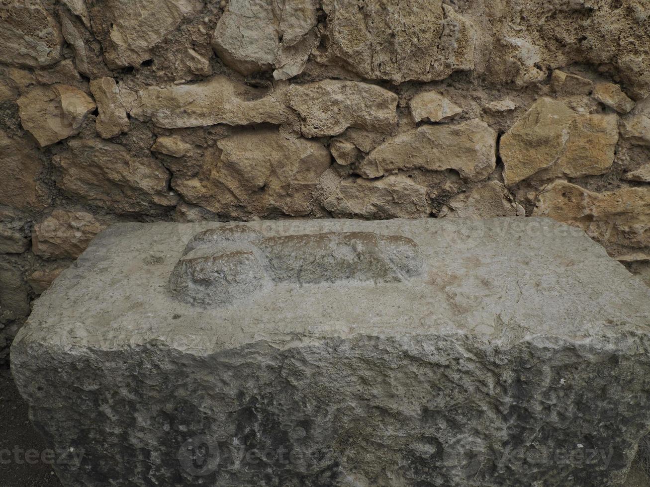 brothel penis sign at Volubilis Roman ruins in Morocco- Best-preserved Roman ruins located between the Imperial Cities of Fez and Meknes photo