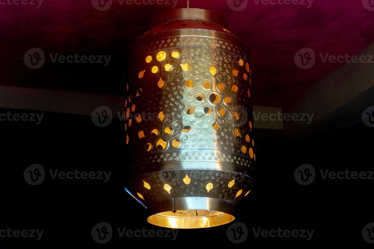 Arabic lamp isolated on black photo