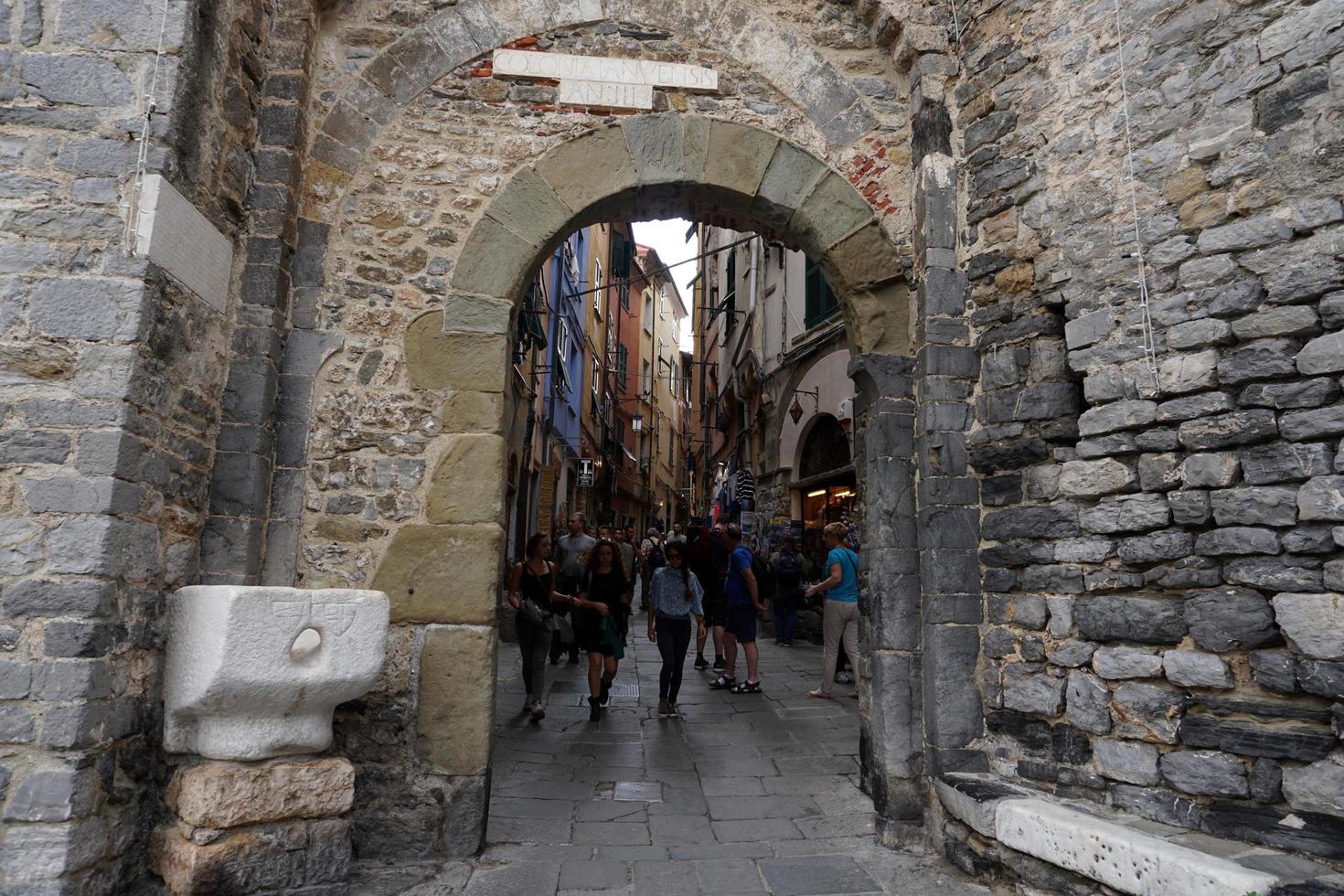 PORTOVENERE, ITALY - SEPTEMBER 24 2017 - Many Tourists in pictoresque italian village photo