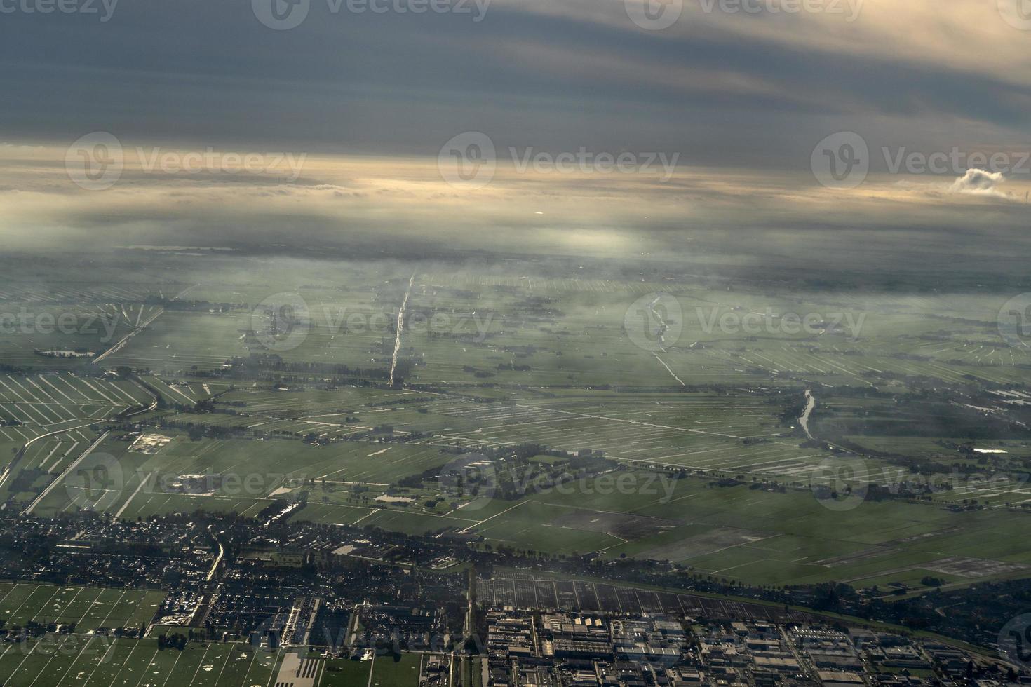 fog and clouds amsterdam area aerial view photo