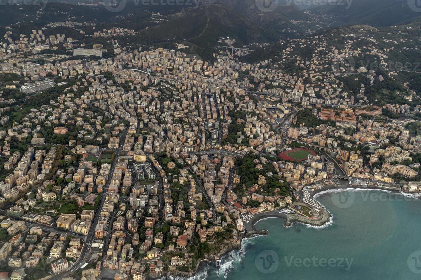 genoa aerial view before landing on cloudy day photo