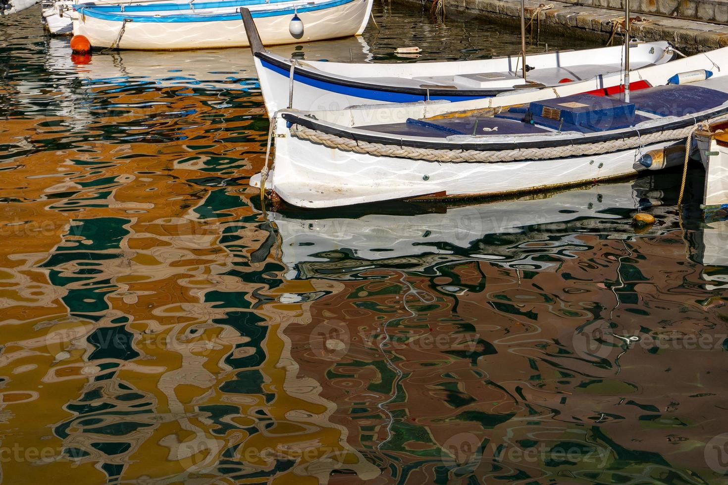 Camogli houses reflection in the harbor water sea photo