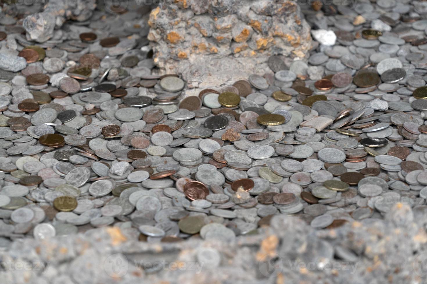 pompei ruins houses full of tourist coins photo