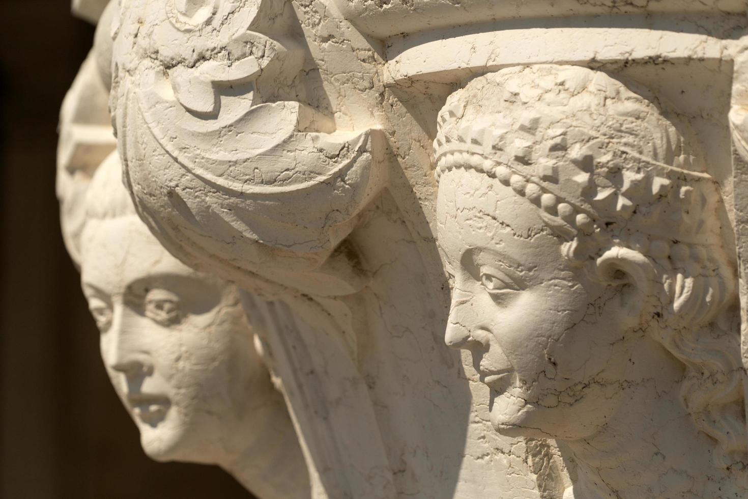 VENICE, ITALY - SEPTEMBER 15 2019 - doge ducal palace capital of column wayside sculpture detail photo