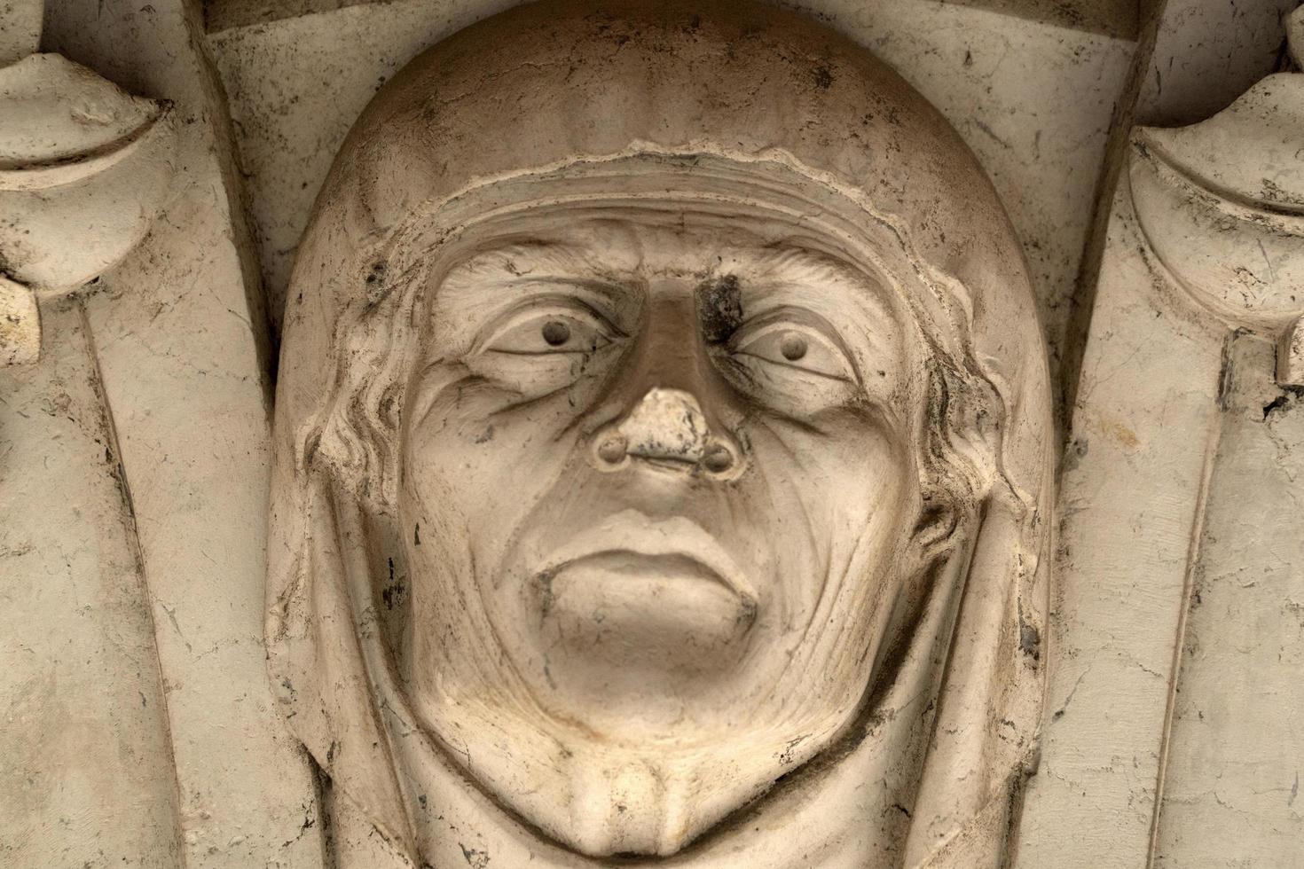 VENICE, ITALY - SEPTEMBER 15 2019 - doge ducal palace capital of column wayside sculpture detail photo