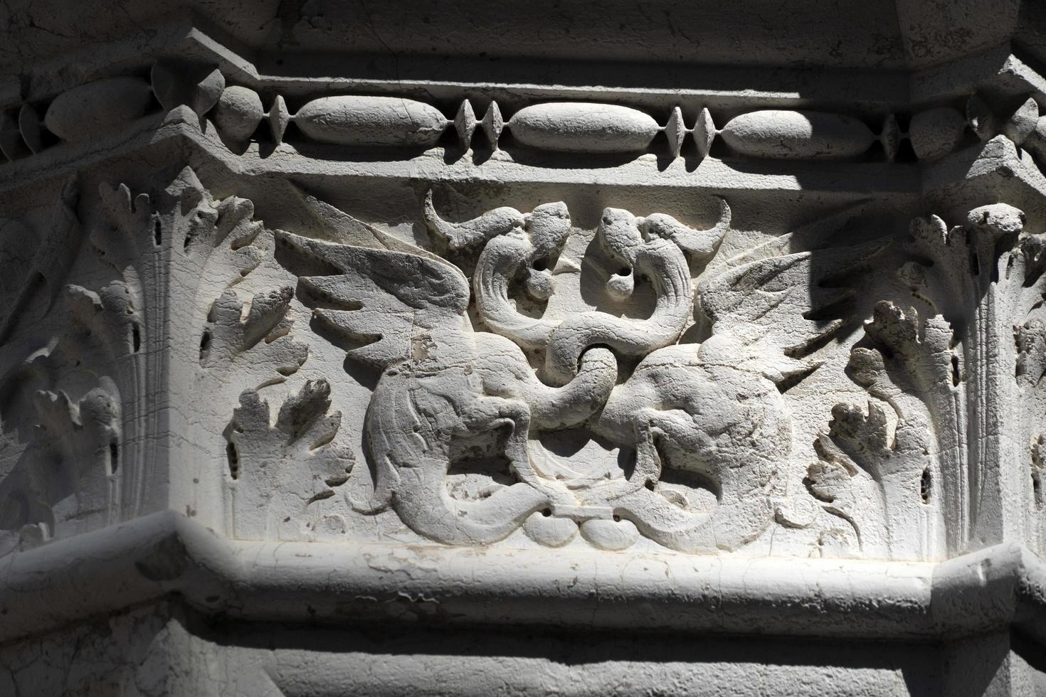 VENICE, ITALY - SEPTEMBER 15 2019 - doge ducal palace capital of column wayside sculpture detail photo