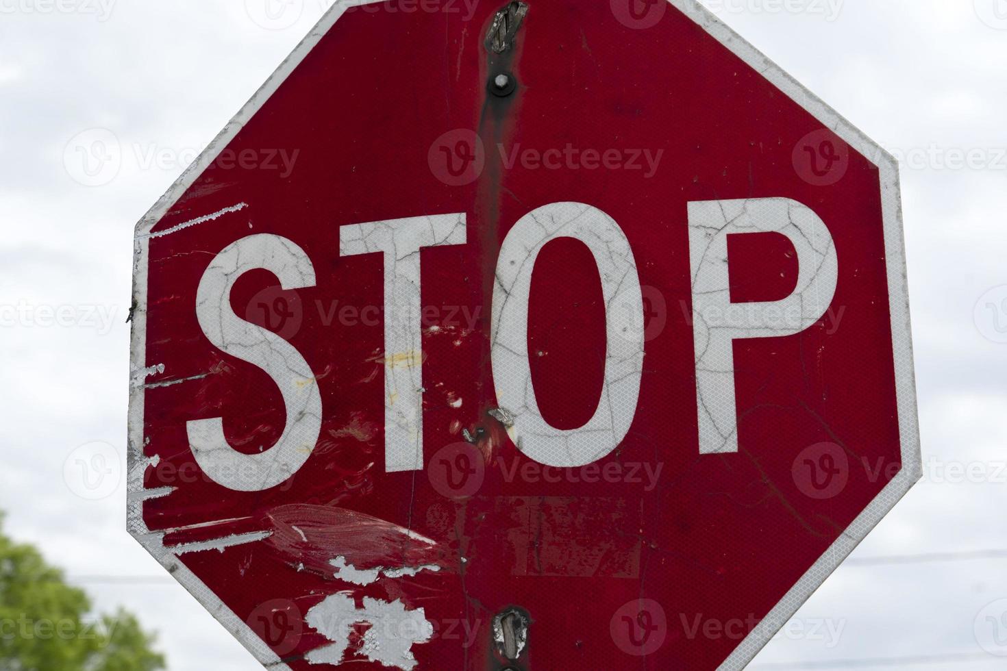 old rusted red stop sign photo