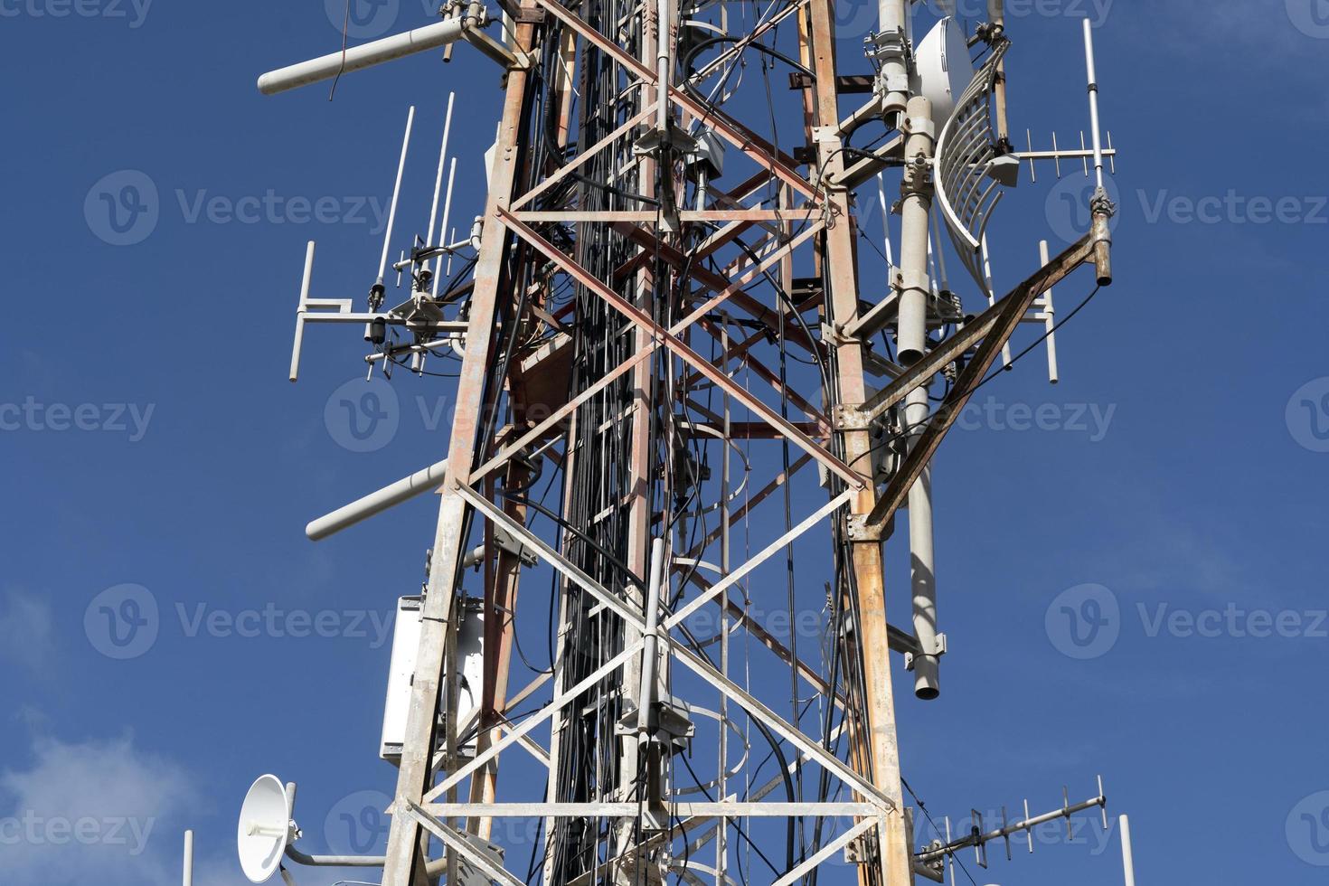 Broadcasting big antenna on blue sky photo