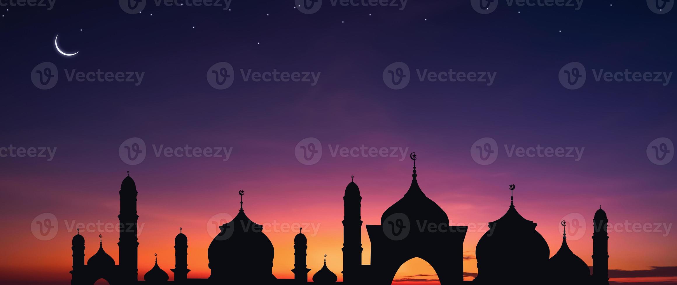 Panoramic view of Silhouette Mosque dome with Crescent moon and stars on Twilight sky background in Iftar period during Ramadan Holy month photo