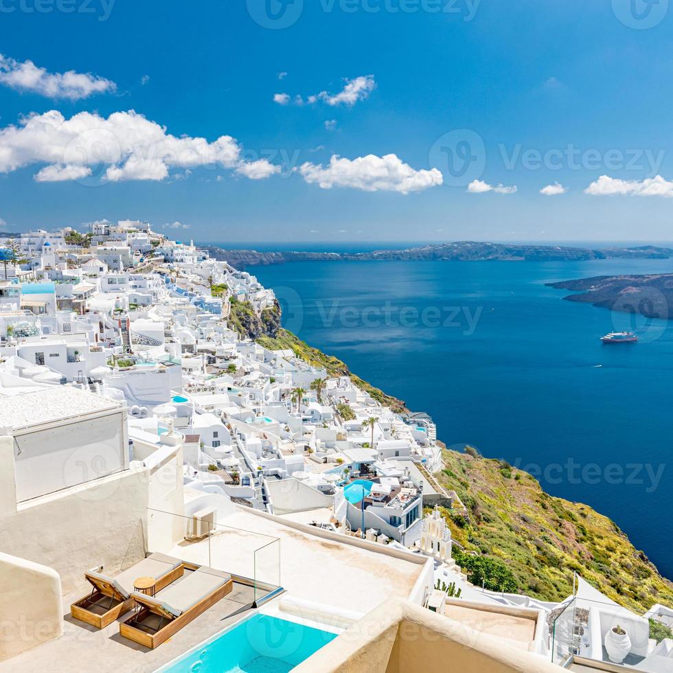 White architecture on Santorini island, Greece. Swimming pool in luxury hotel. Beautiful view, sky over blue sea. Summer vacation and holiday as travel destination concept, amazing tourism background photo