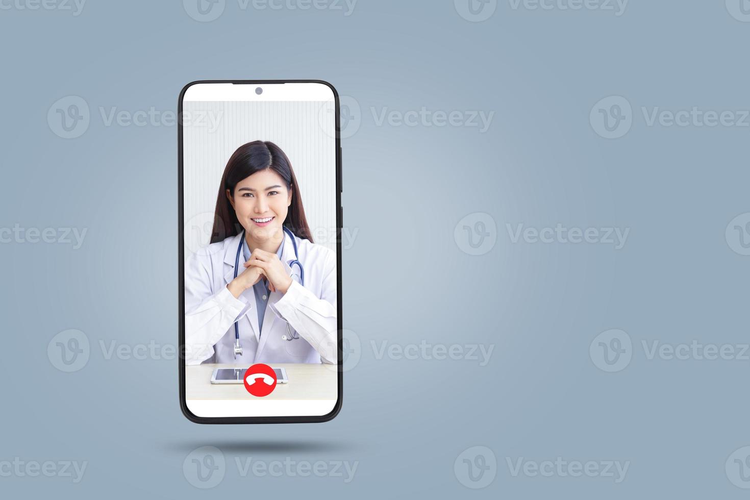 Female doctor chatting online with patients. Black smartphone concept Connect to communication via online technology. The doctor can examine the patient via video call. Clipping Path photo