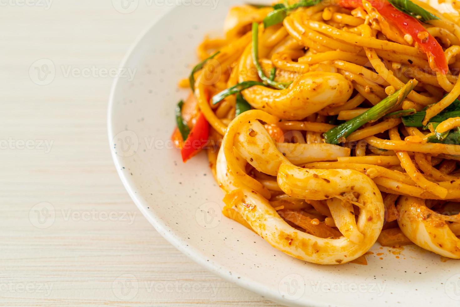 stir-fried spaghetti with salted egg and squid photo