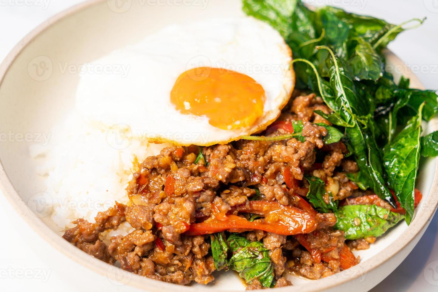 Stir fried Thai basil with wagyu beef and fried egg photo
