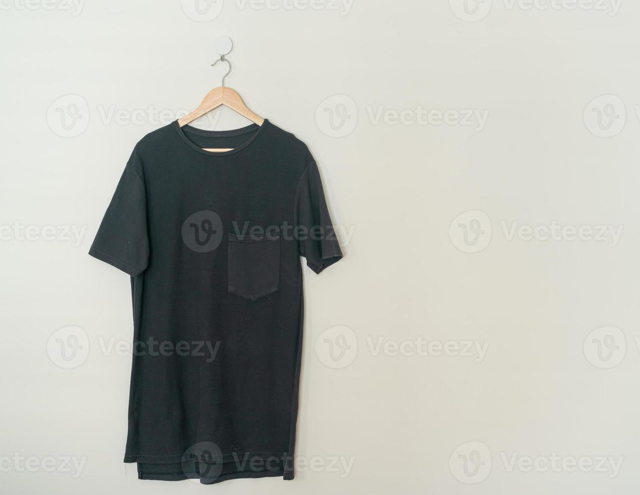 t-shirt hanging with wood hanger photo