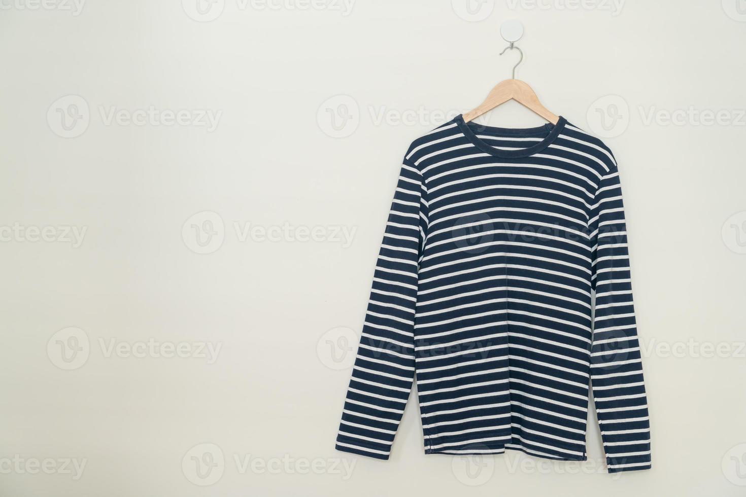 t-shirt hanging with wood hanger photo