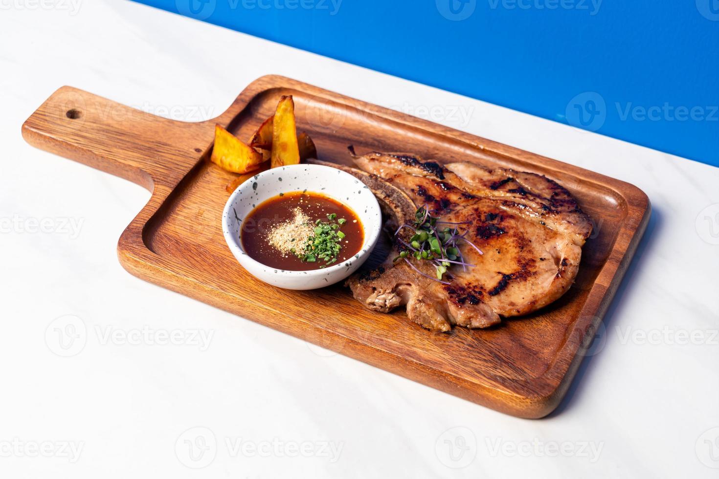 grilled pork chop steak with spicy jaew sauce photo
