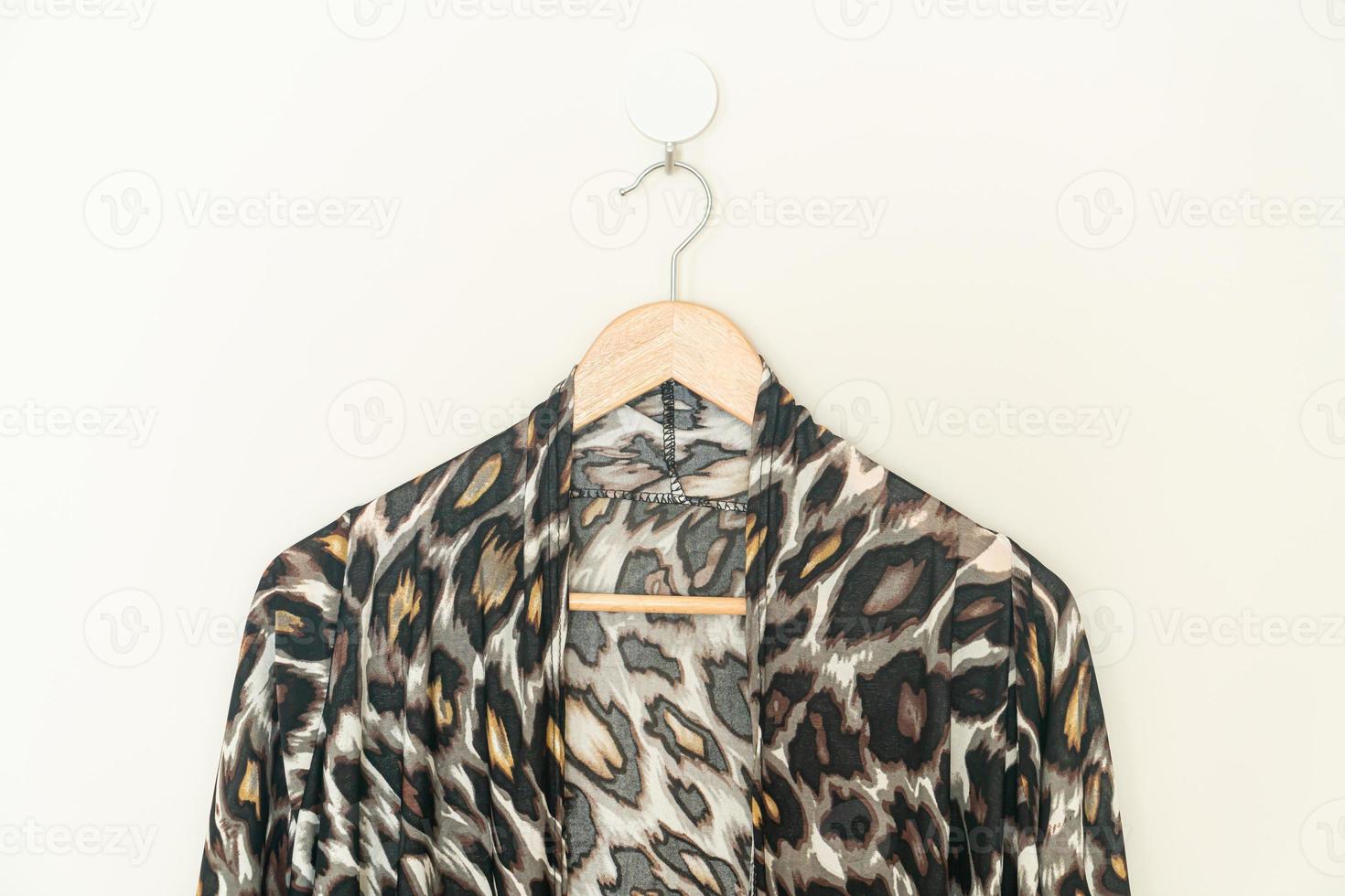 beautiful leopard print shirt hanging on wall photo