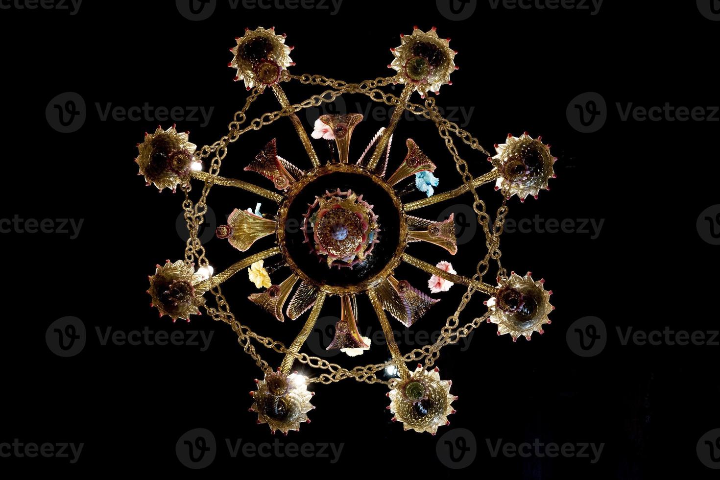 murano glass chandelier isolated on black photo