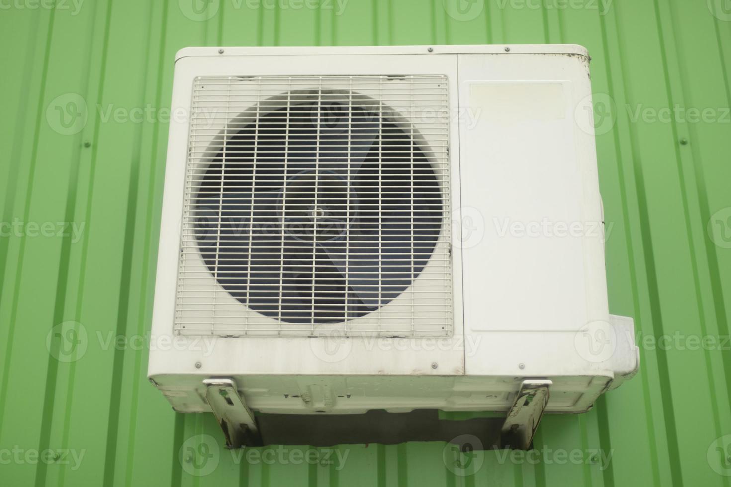 Air conditioning on wall. White air conditioning on building. Cooling system. photo