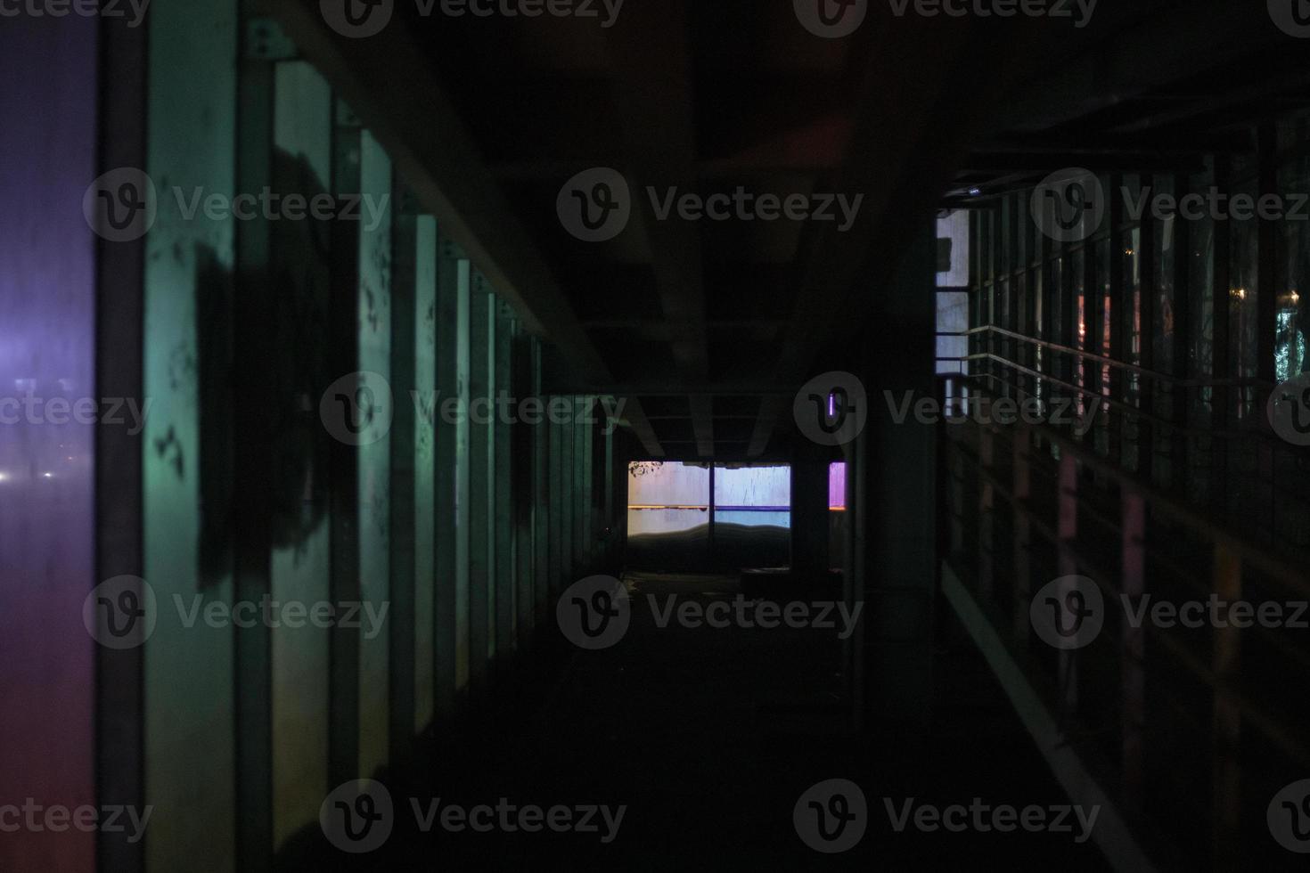 Light at night. Neon glow in tunnel. Light through glass. photo