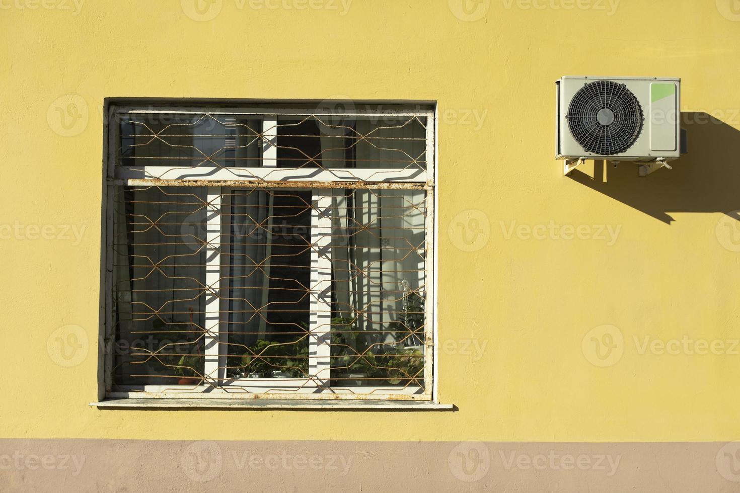 Window and air conditioning. Window in building outside. Architecture details. photo