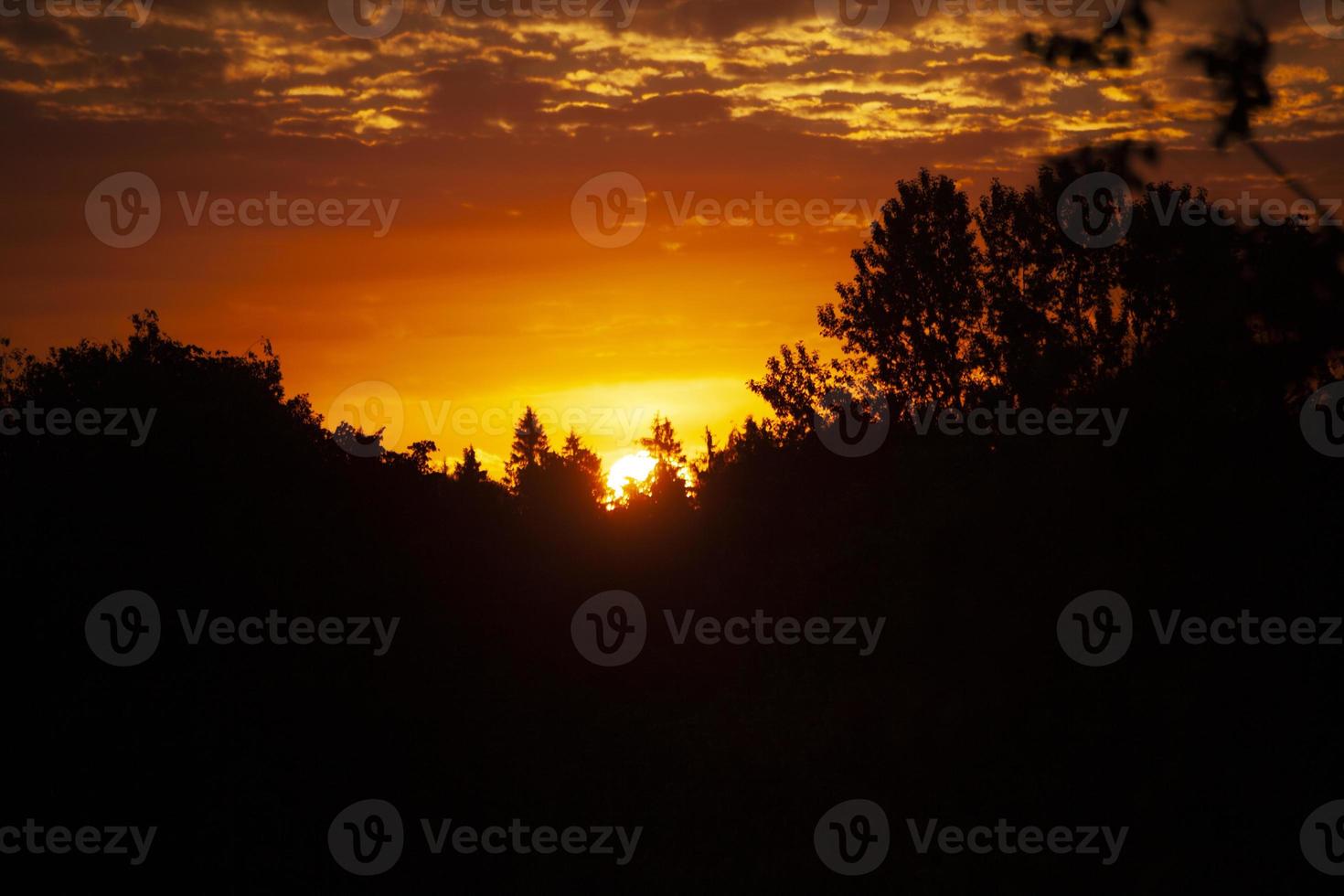 Sunset. Dawn in morning. Warm light in sky. Heavenly landscape in village. photo