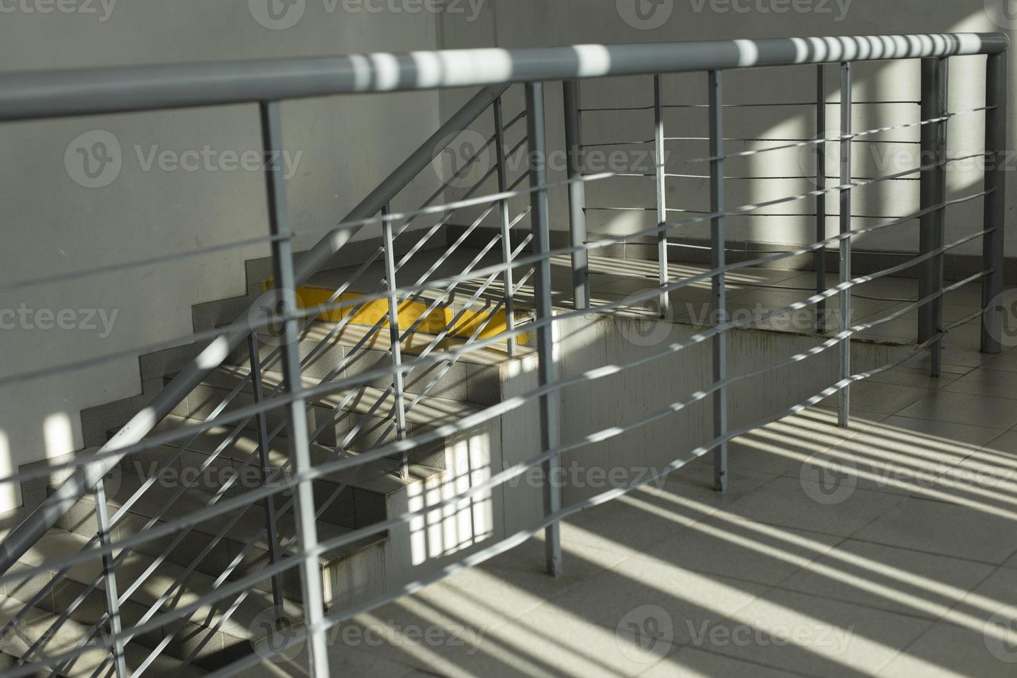 Handrail and ladder. Stairs in building. Empty entrance. photo