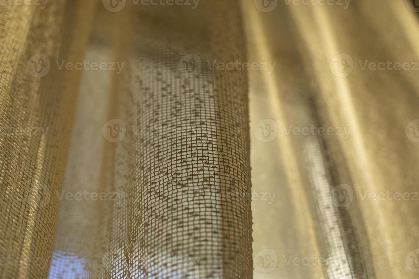 Curtains on window. Light through fabric. photo
